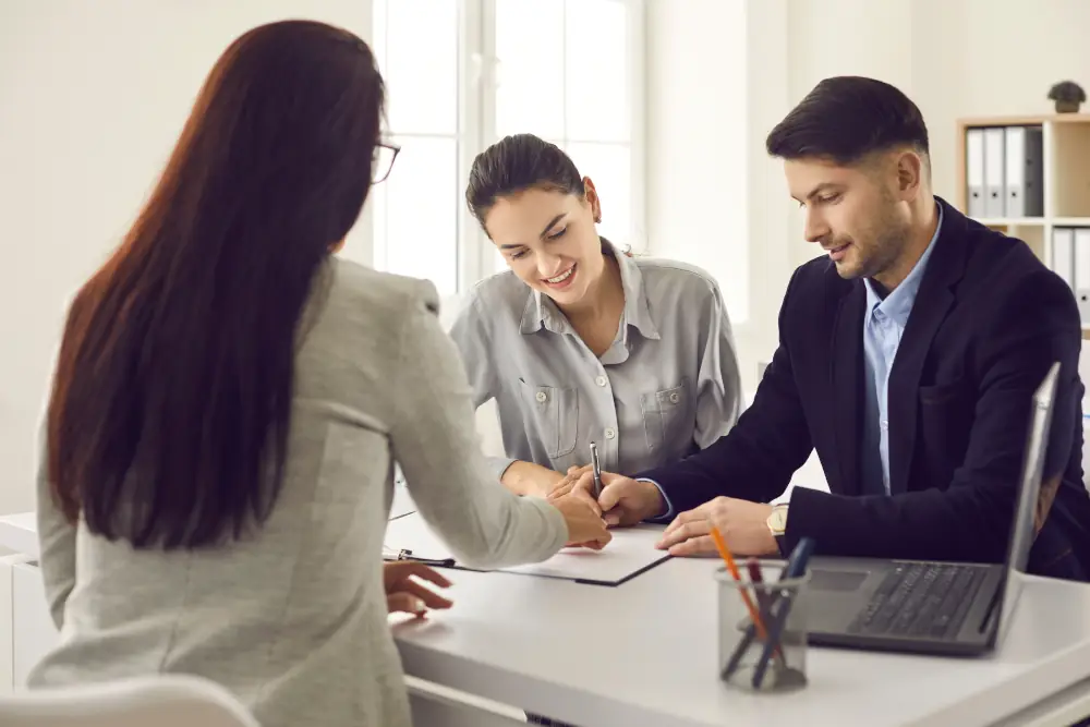 A couple signing a home loan