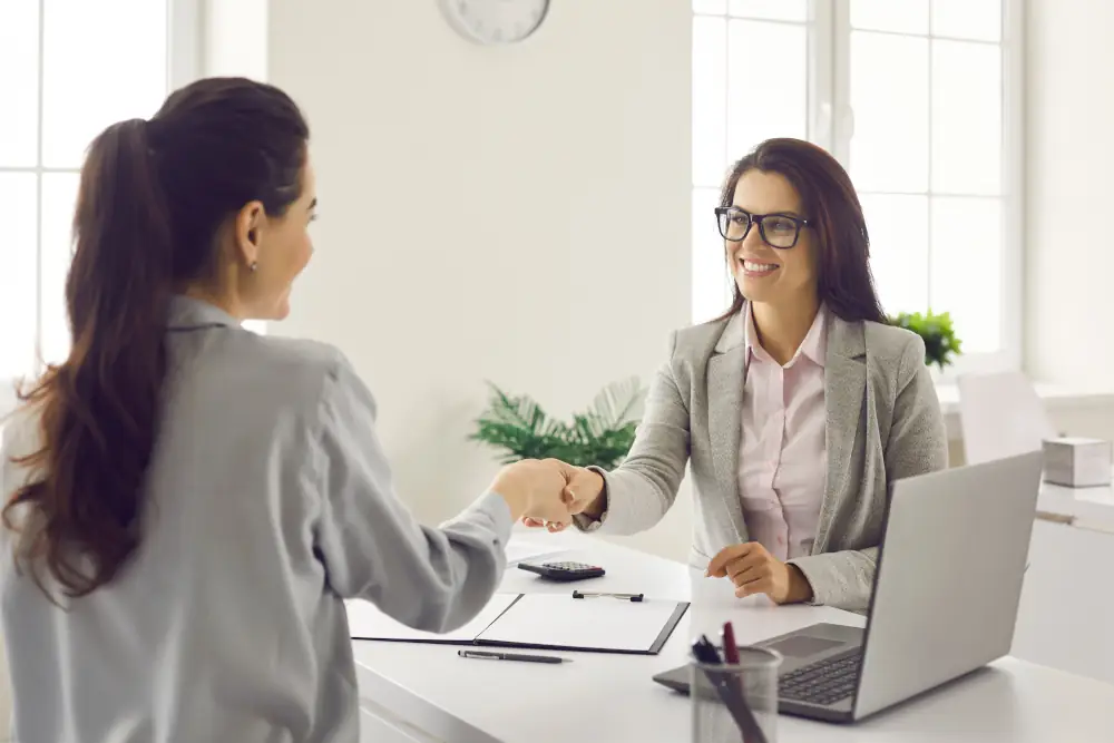 2 professionals shaking hands