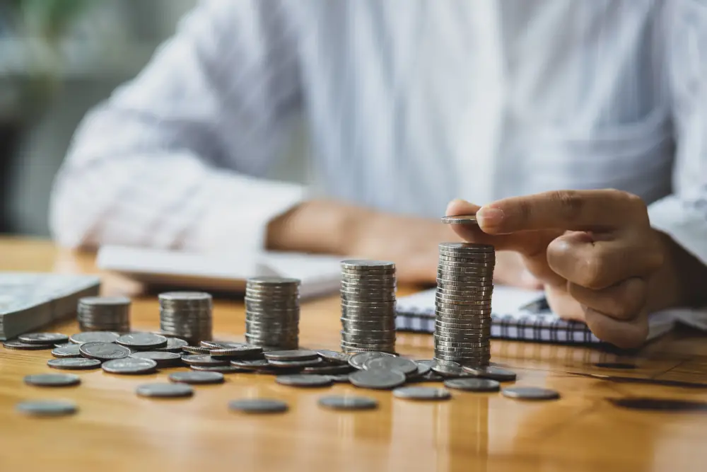 Someone stacking towers of coins